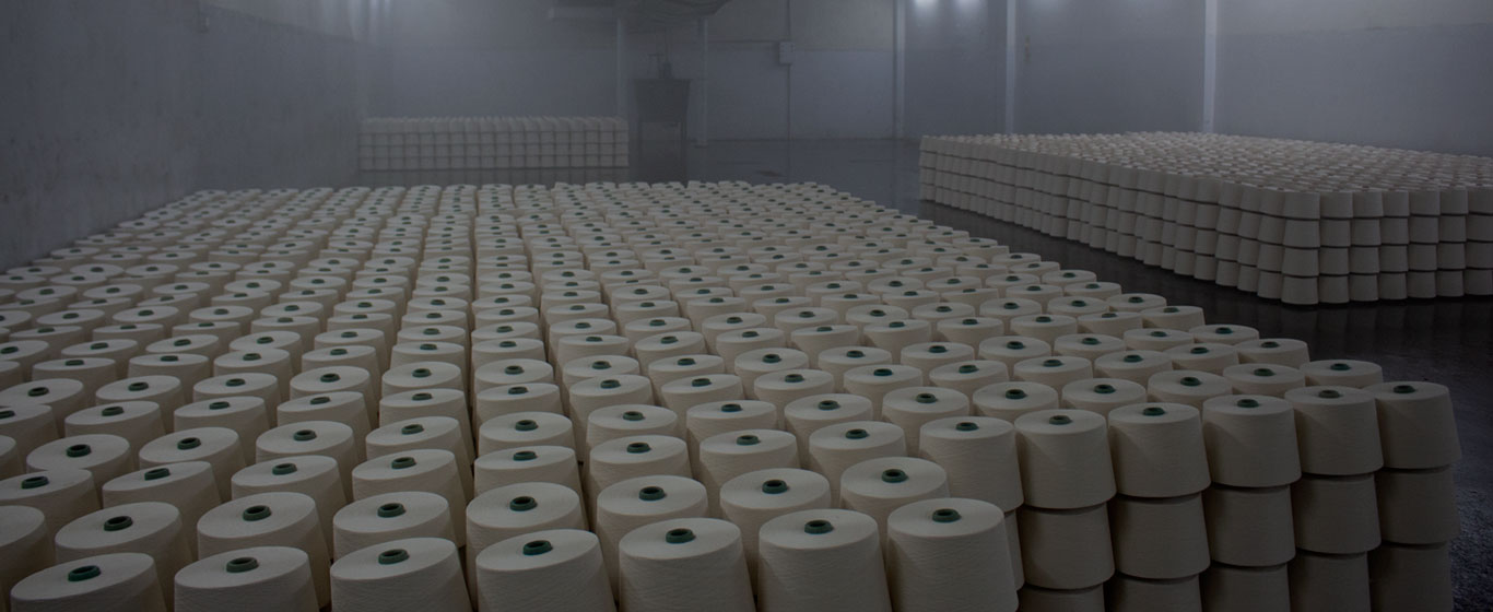 Finished yarn cones staged in the warehouse