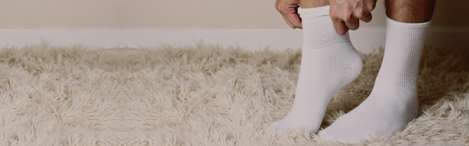 Person wearing white crew socks